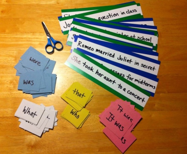 photo of sentence strips and small pieces of paper with words like was were what that